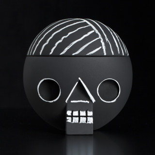 Acne Jr toy by JR–Work–Shop, black sphere with white geometric face design