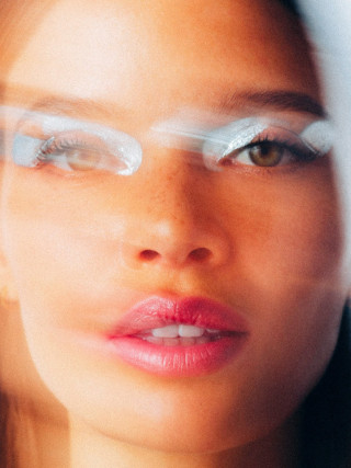 Vivienne Balla photograph showing close-up of woman's face with bold makeup