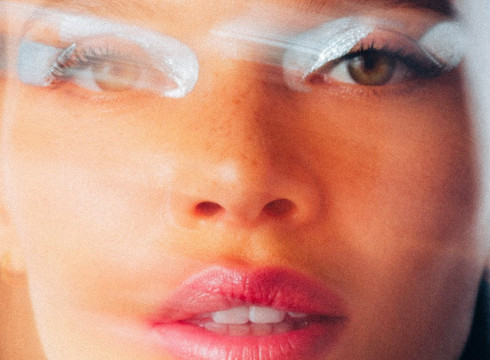 Vivienne Balla photograph showing close-up of woman's face with bold makeup