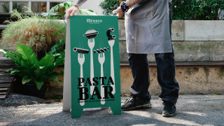 Etrusco Pasta Bar sign with fork illustrations and pasta shapes