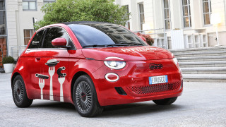Red car with Etrusco Pasta branding and utensil graphics on the side