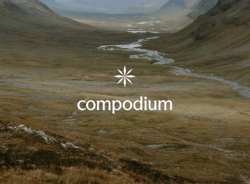 Compodium logo over a vast valley landscape