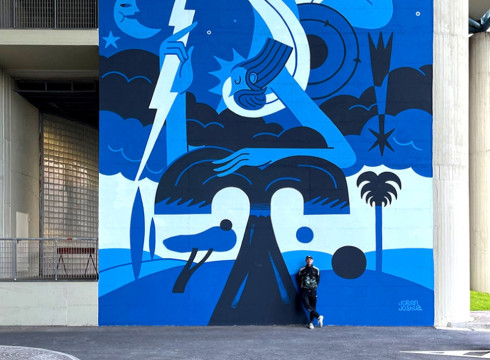Joren Joshua's Napoli Mural featuring a stylized blue figure holding a lightning bolt