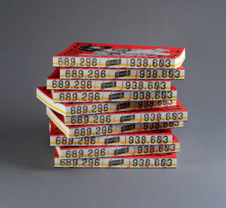 Stack of 'The NoGood Book' with red covers and visible spine numbers